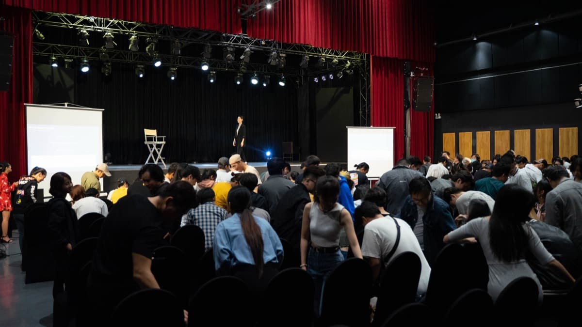 Kathy Uyen addressing an audience
