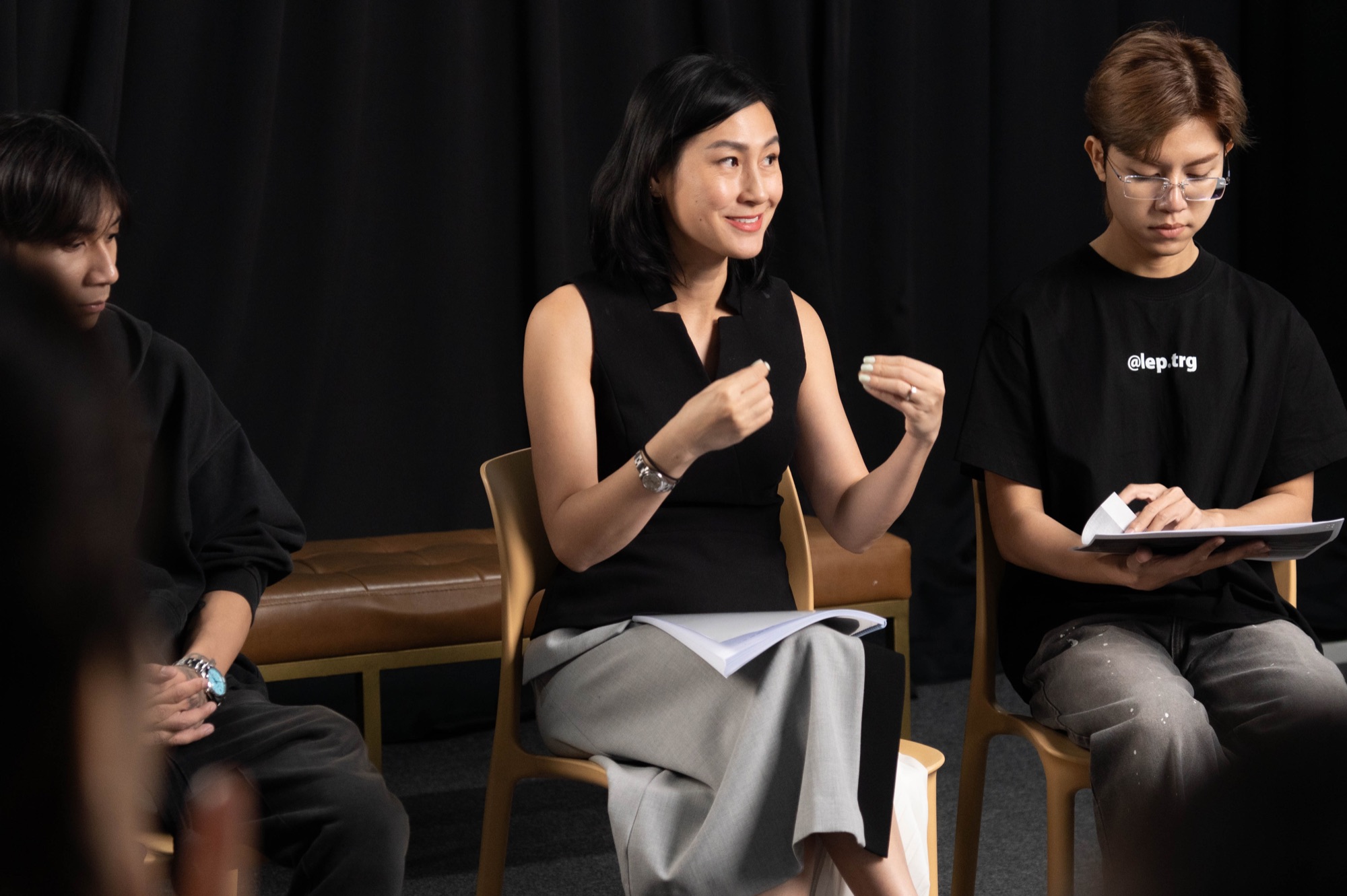 Kathy Uyen in a classroom circle with students